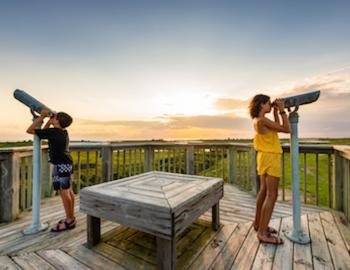 kids looking through view finders at a nature reserve in the Outer Banks