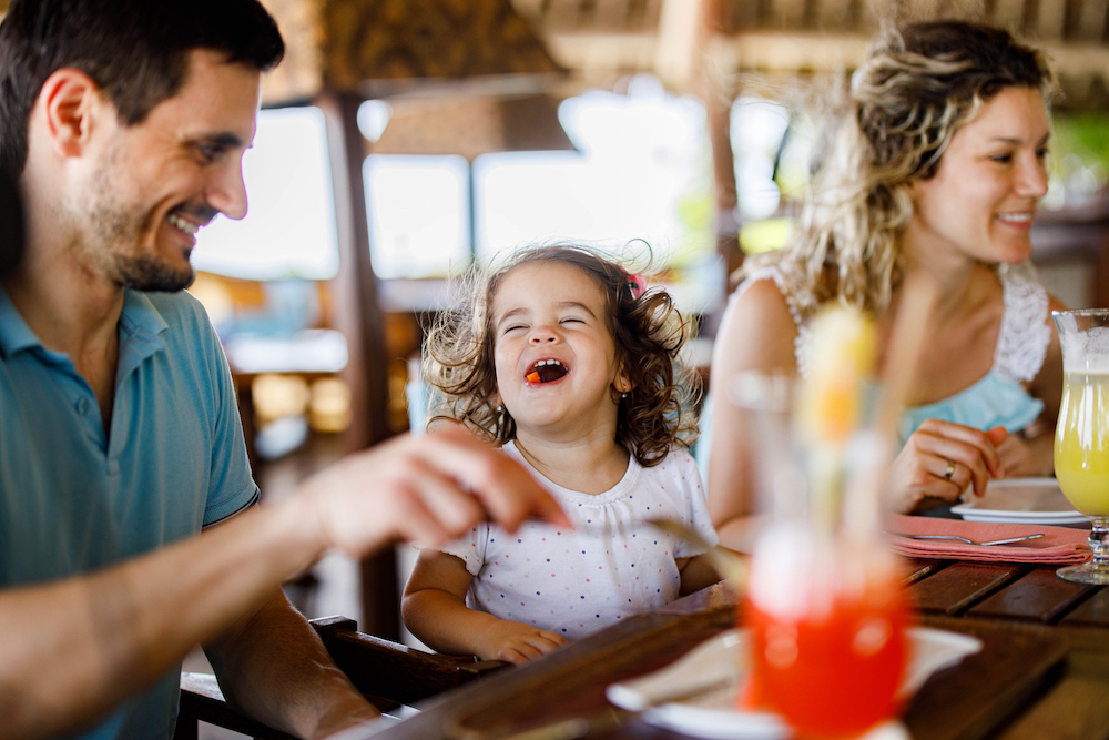 Family out to dinner at the beach