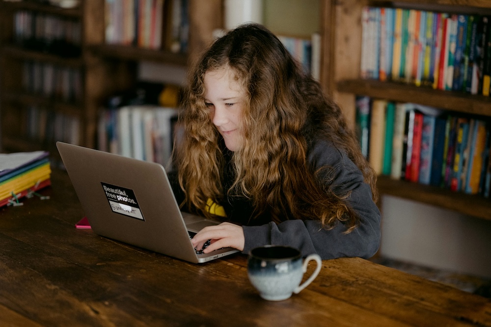 girl at computer in a library